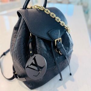 Louis Vuitton Black Leather Backpack with Gold Chain Detail